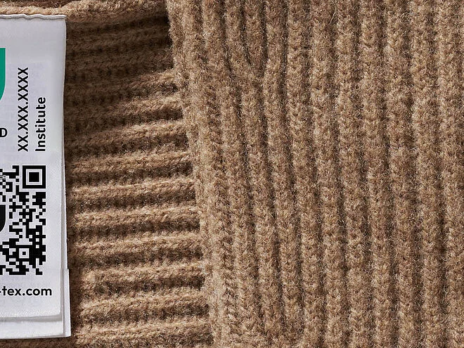OEKO-TEX STANDARD 100 label on a sweater