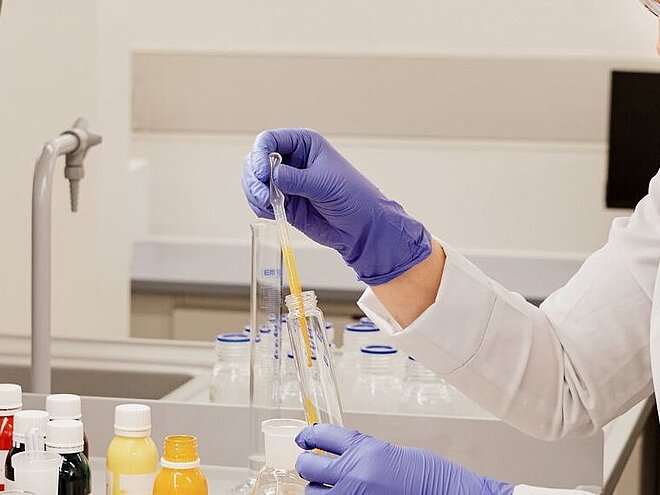 Laboratory technician testing chemicals