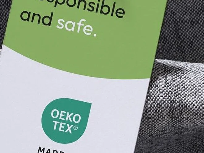 Grey fabric with a MADE IN GREEN hangtag